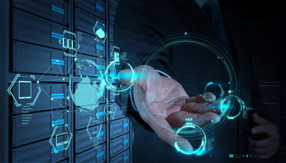 A man in a suit is interacting with a data server at the General Services Administration.