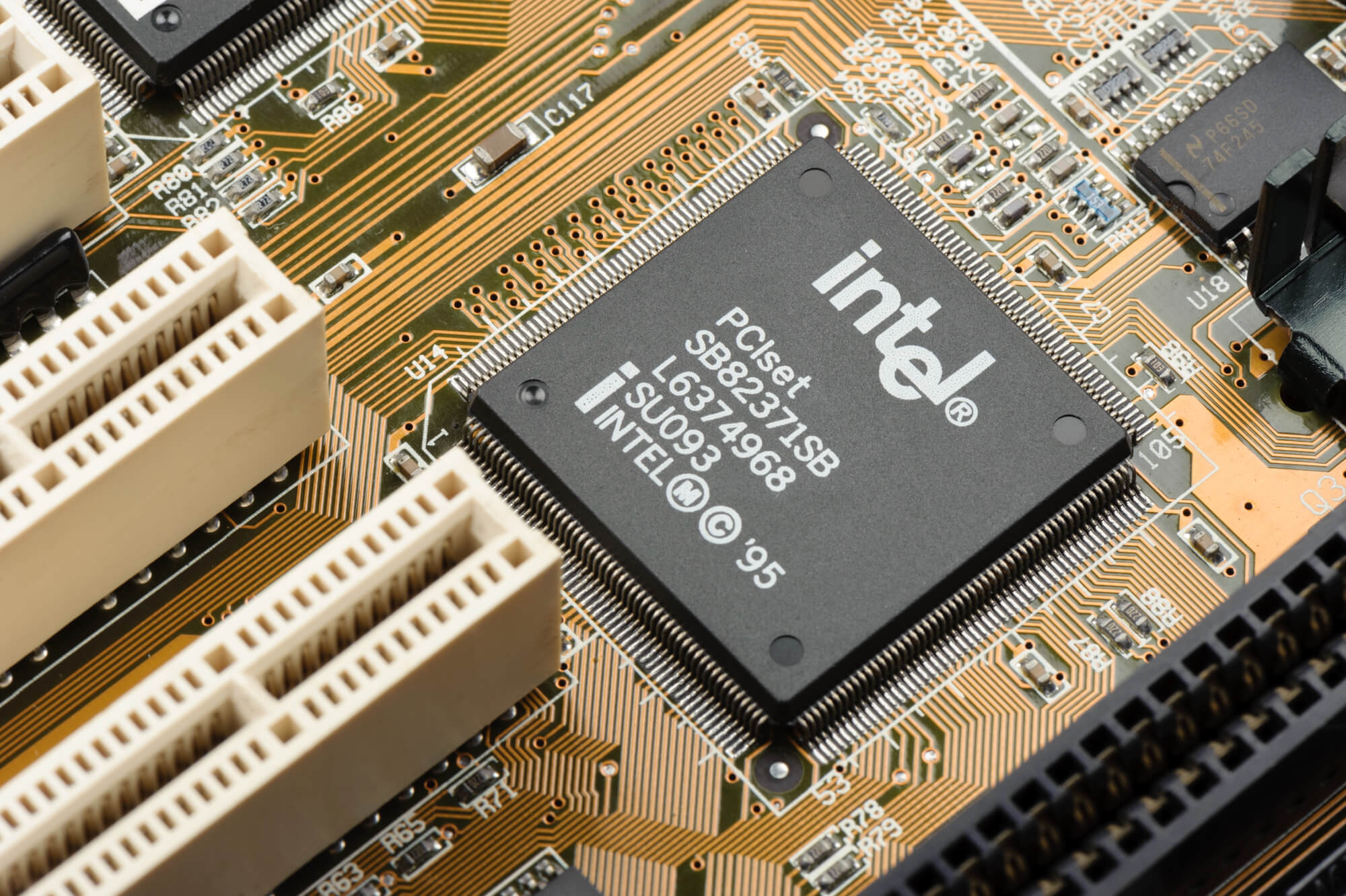 Close-up view of an Intel PCIset chip on a computer motherboard with visible circuits and connectors, showcasing the integration of HPC technology.